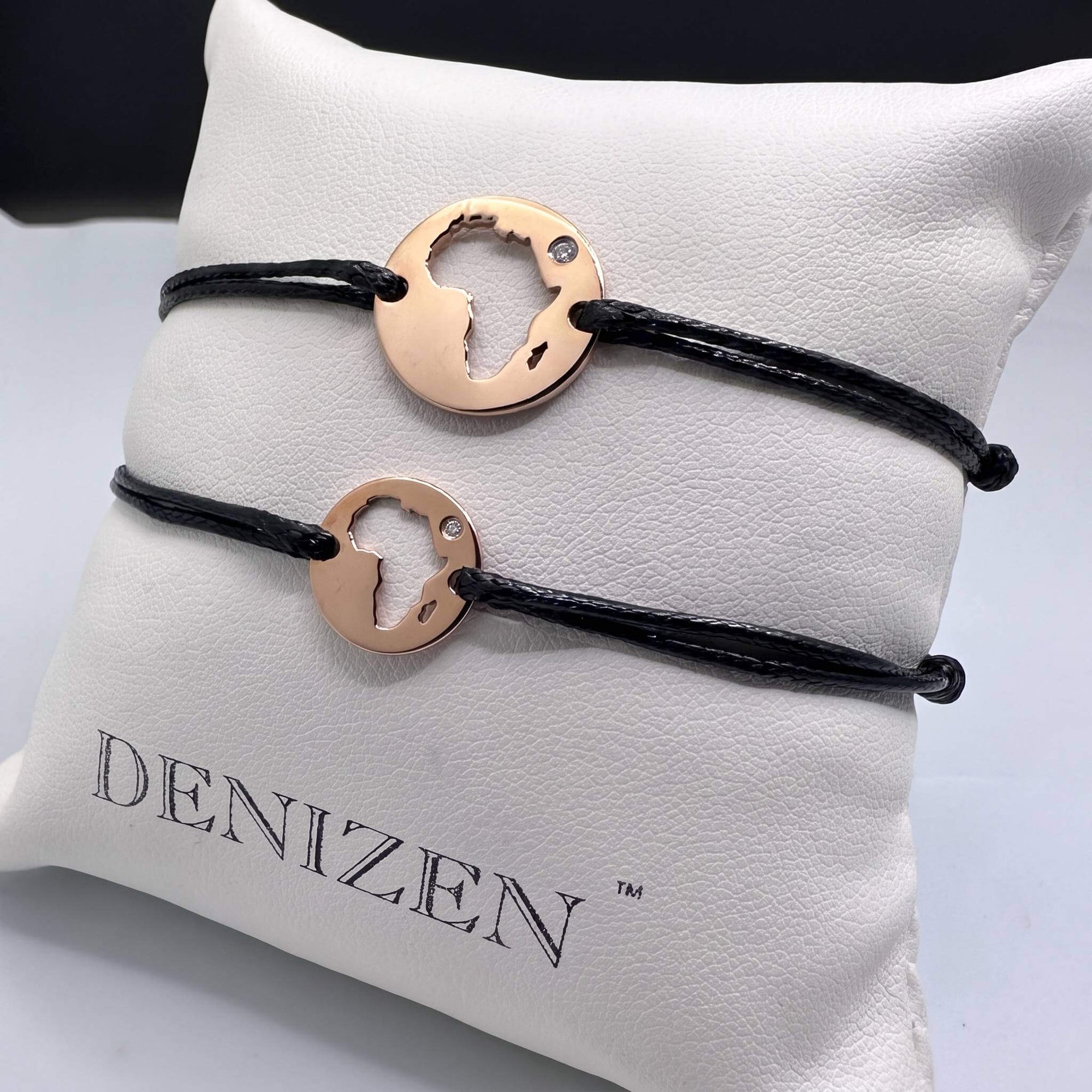 DENIZEN bracelets of Africa map cutout in rose gold and black strings