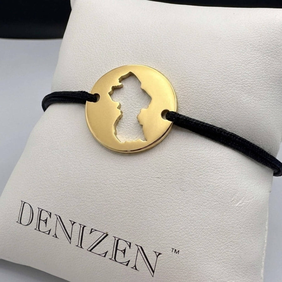 Gold bracelet with a cutout of the map of Guyana