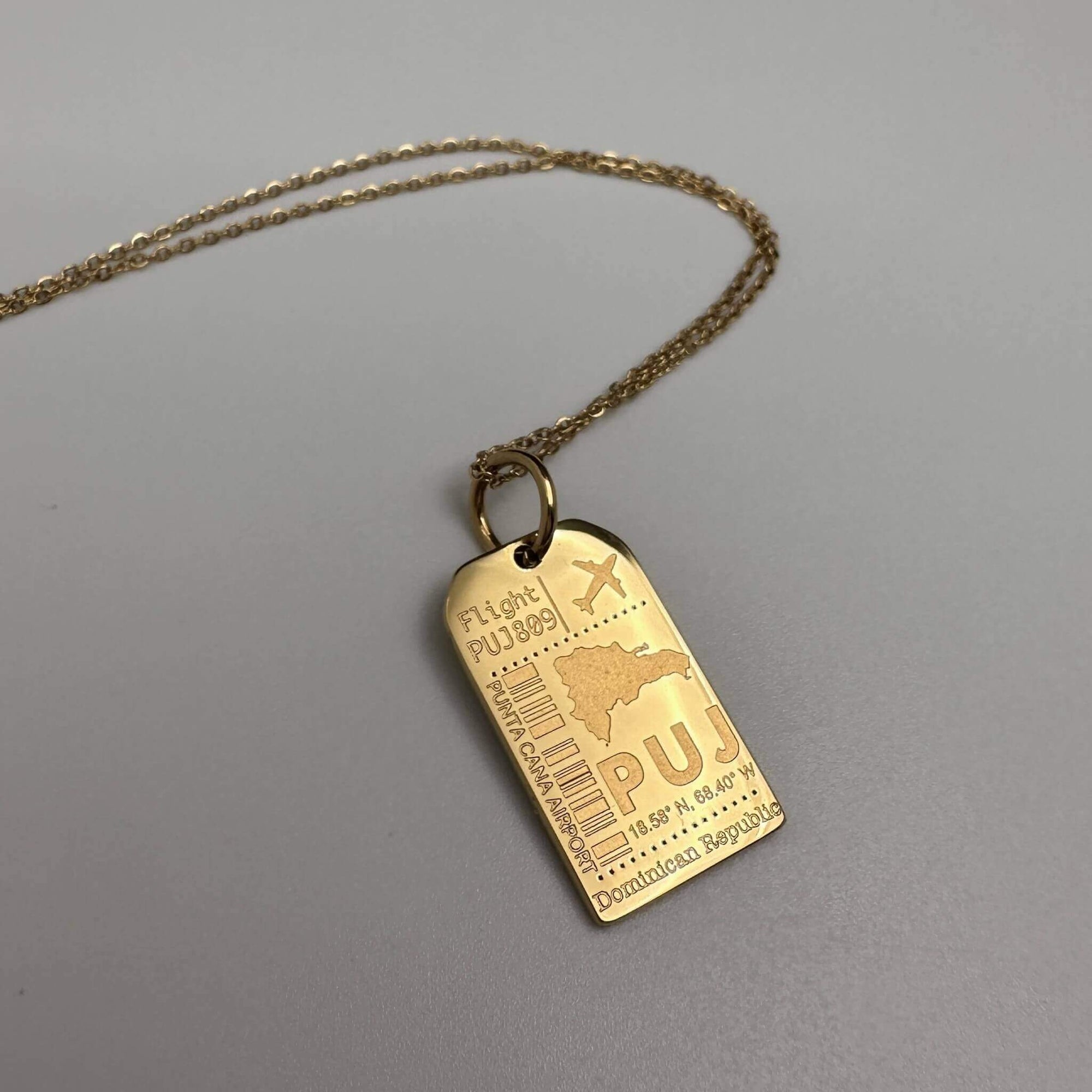 DENIZEN gold luggage tag charm of Punta Cana