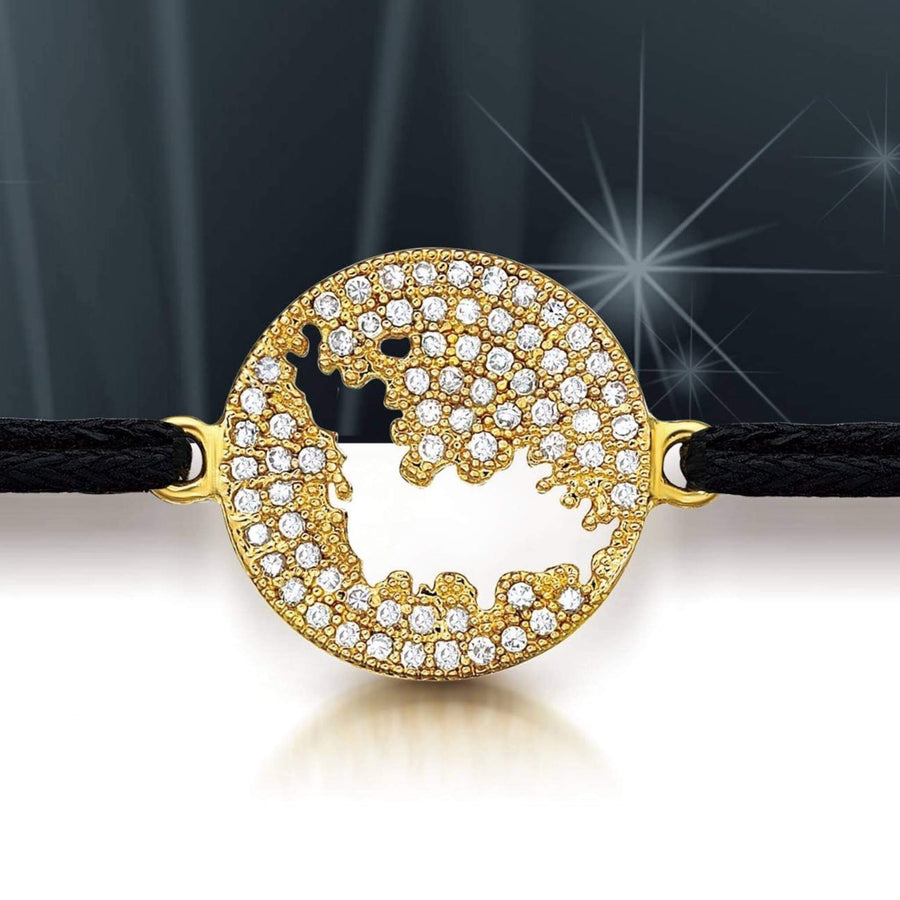 A round gold bracelet featuring a cutout of  the map of St Barth, embellished with clear pavé rhinestones, attached to a black braided cord.