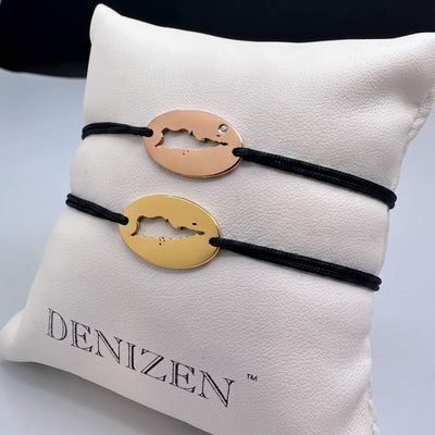 DENIZEN bracelets of St Croix map in gold and rose gold in mini size with black strings