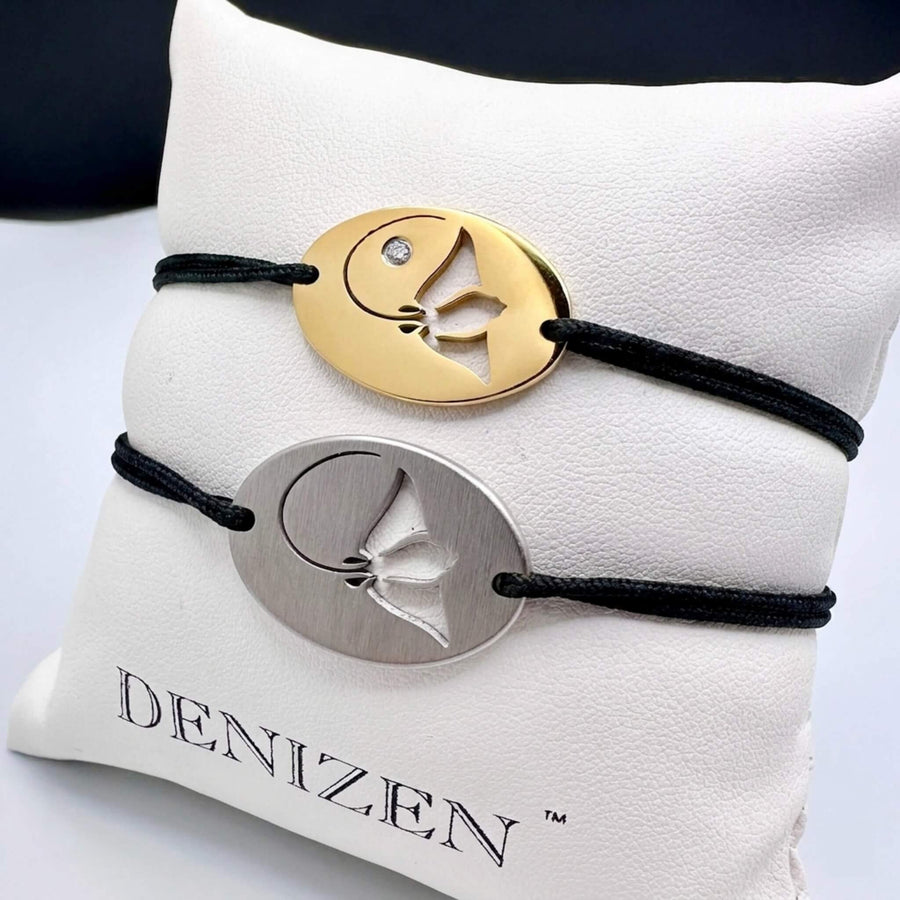 DENIZEN bracelets of stingray silhouette in brushed and gold-plated stainless steel with navy and turquoise string