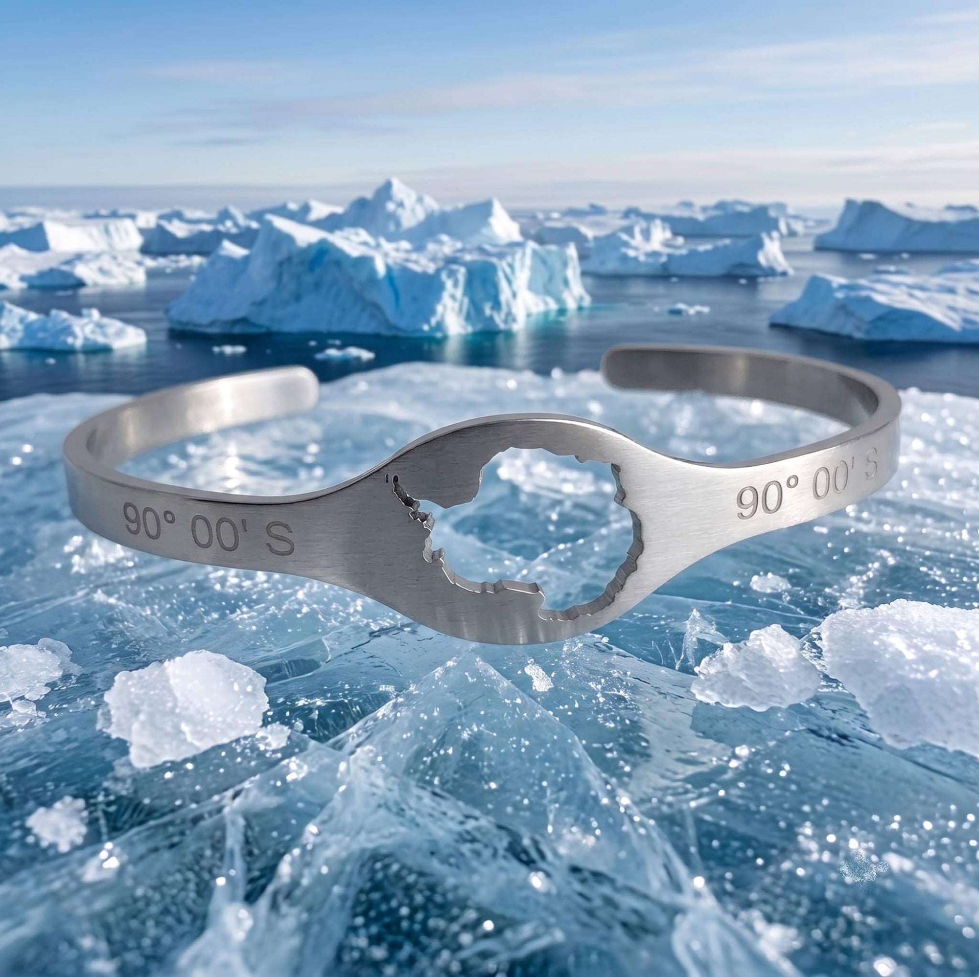 DENIZEN cuff with Antarctica map and coordinates in brushed silver