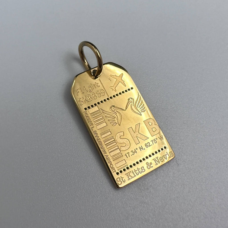 DENIZEN gold luggage tag charm of St Kitts and Nevis