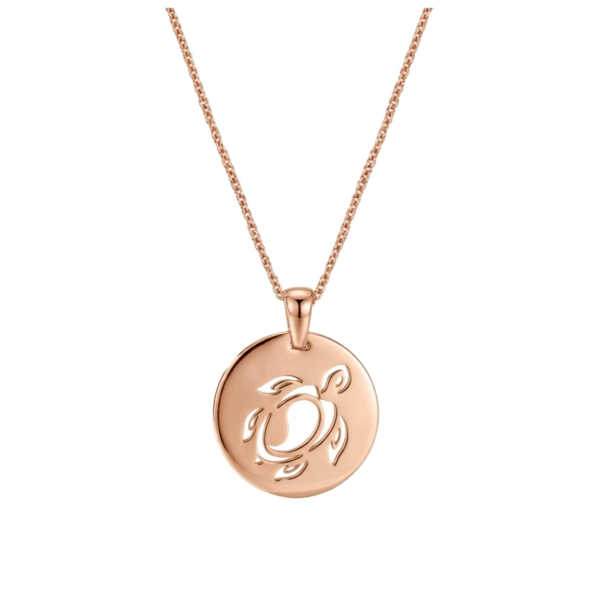 A rose gold necklace with a circular pendant featuring a cutout sea turtle design, shown against a plain white background.