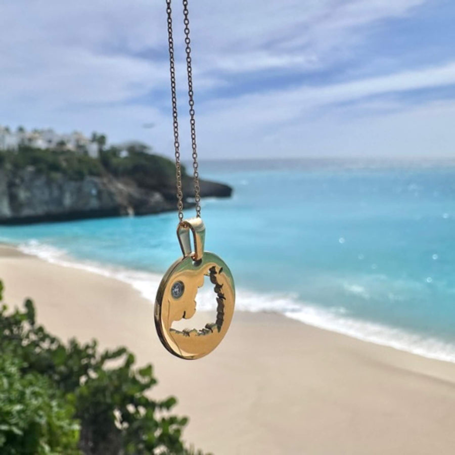 Gold pendant with the cutout map of Sint Maarten
